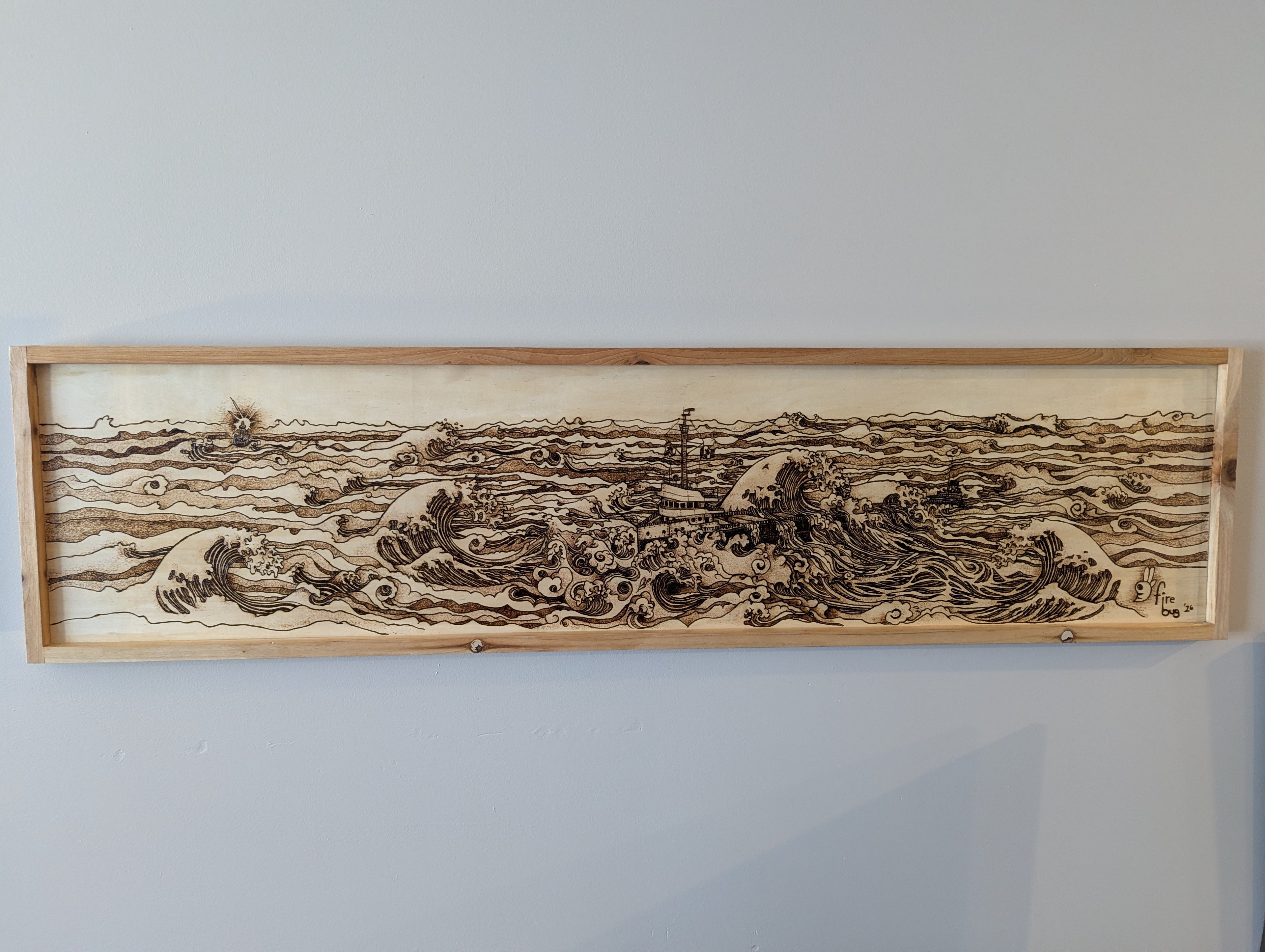 Hand drawn and wood burned artwork of the Edmund Fitzgerald