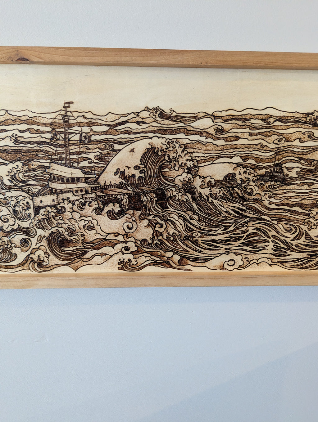 Hand drawn and wood burned artwork of the Edmund Fitzgerald